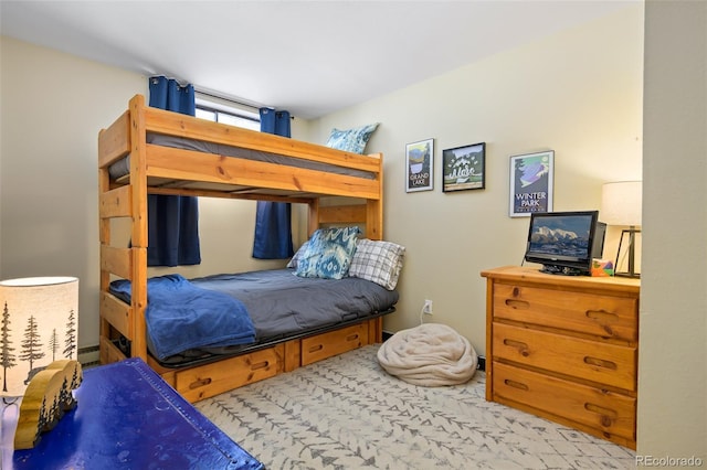 bedroom featuring light carpet