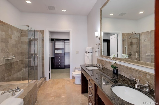 full bathroom with recessed lighting, visible vents, a stall shower, and a sink