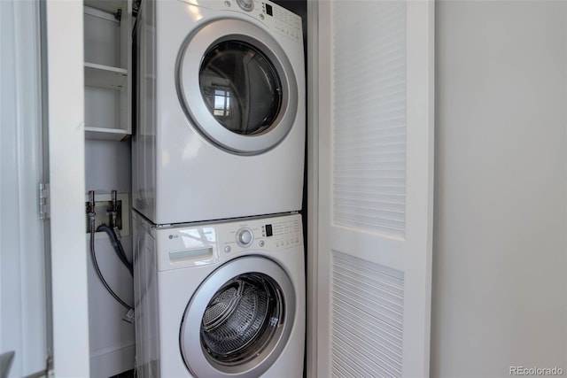 laundry room featuring laundry area and stacked washer and dryer