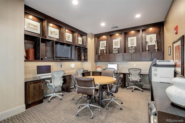 carpeted office featuring built in study area, visible vents, and recessed lighting