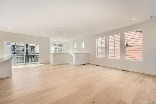 unfurnished living room with light hardwood / wood-style floors