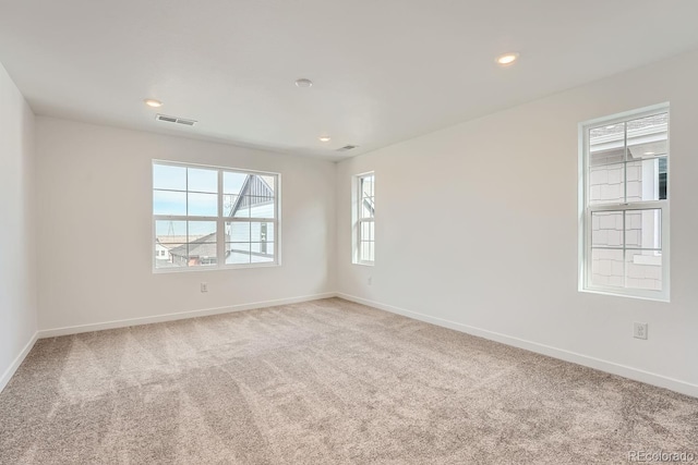 unfurnished room featuring carpet flooring