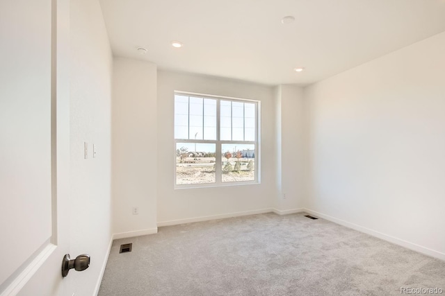 empty room with light colored carpet