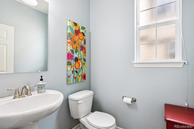 9311 E 5th Ave, Denver, CO 80230 - half bathroom featuring a sink and toilet