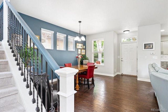9311 E 5th Ave, Denver, CO 80230 - foyer entrance featuring dark wood finished floors, a chandelier, and stairway
