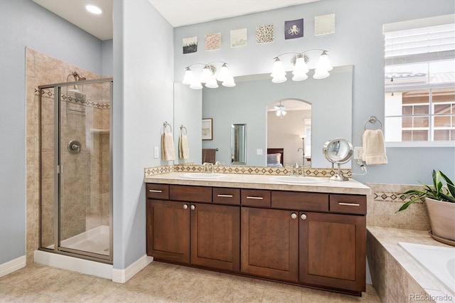 9311 E 5th Ave, Denver, CO 80230 - bathroom with a stall shower, a bath, double vanity, a ceiling fan, and tile patterned floors