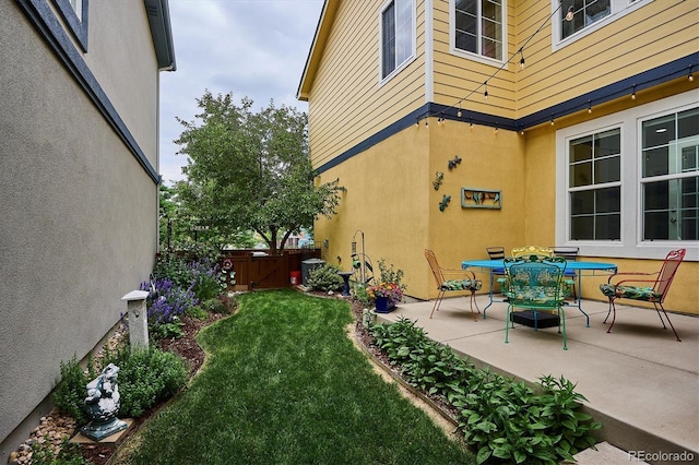 9311 E 5th Ave, Denver, CO 80230 - view of green lawn featuring a patio