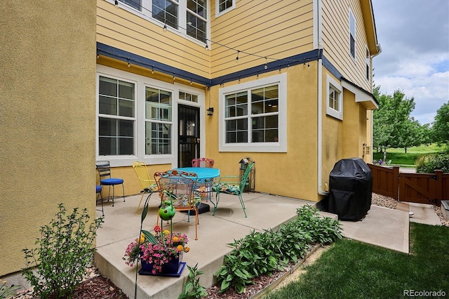 9311 E 5th Ave, Denver, CO 80230 - view of patio featuring area for grilling and a gate