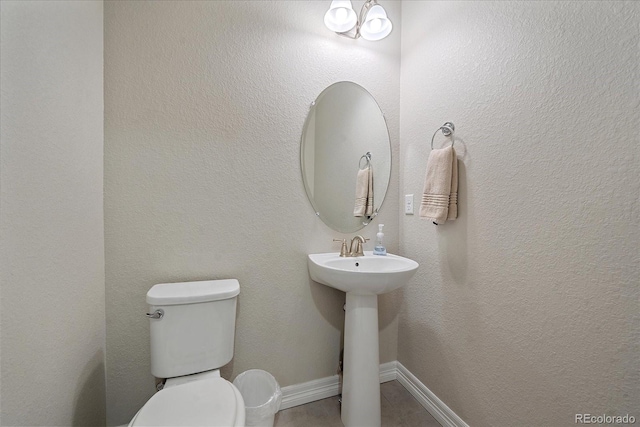 bathroom featuring sink and toilet