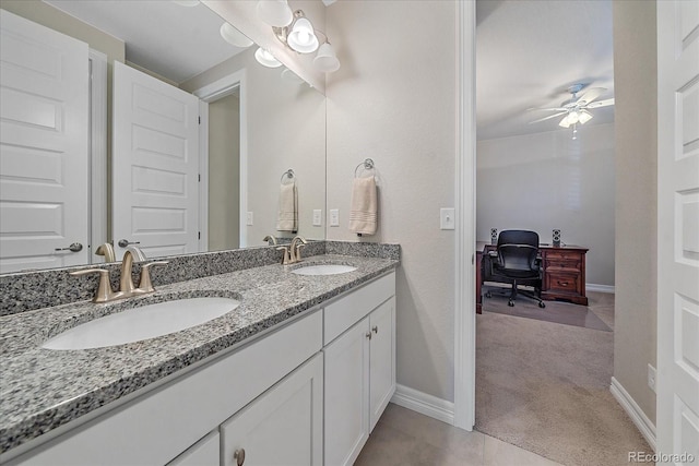 bathroom featuring tile patterned floors, ceiling fan, and vanity