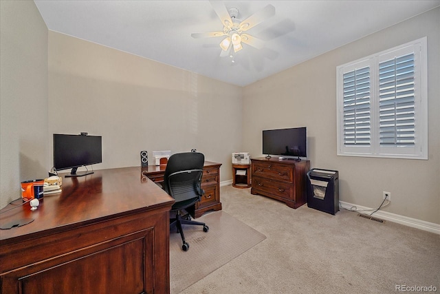 office space with ceiling fan and light carpet