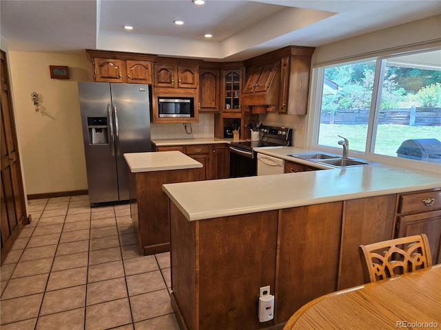 7290 S Cook Cir, Centennial, CO 80122 - kitchen featuring stainless steel appliances, custom exhaust hood, light countertops, tasteful backsplash, and a center island