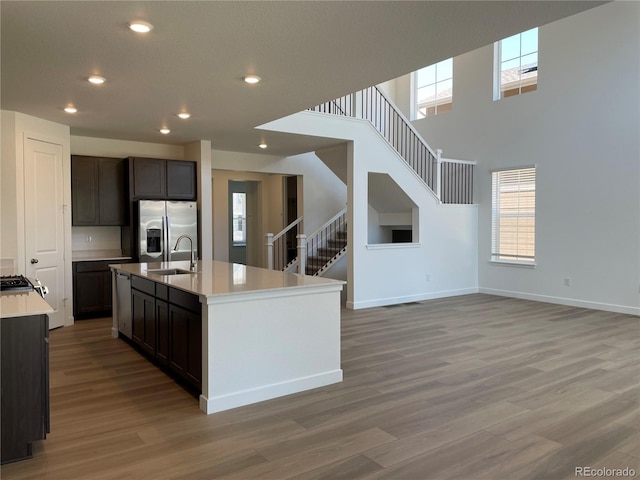 4598 Windmill Dr, Brighton, CO 80601 - kitchen featuring appliances with stainless steel finishes, light wood-style flooring, light countertops, plenty of natural light, and recessed lighting