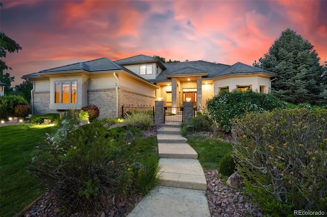 5350 S Marshall St, Littleton, CO 80123 - prairie-style house with brick siding, a garage, and a gate