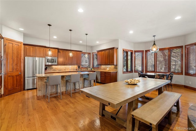5350 S Marshall St, Littleton, CO 80123 - dining room with recessed lighting, light wood-type flooring, and baseboards