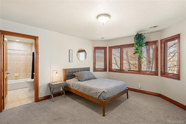 5350 S Marshall St, Littleton, CO 80123 - bedroom with light colored carpet, baseboards, and connected bathroom