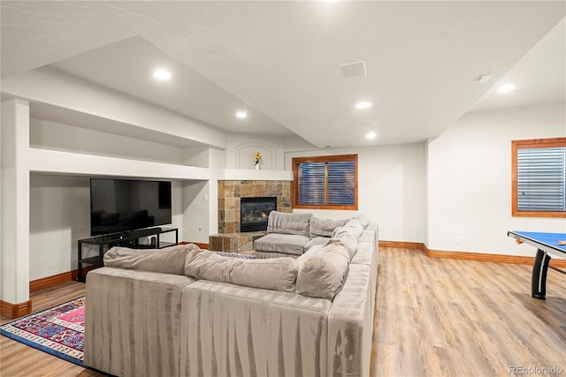 5350 S Marshall St, Littleton, CO 80123 - living room featuring baseboards, light wood finished floors, a tile fireplace, and recessed lighting