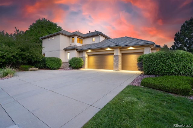 5350 S Marshall St, Littleton, CO 80123 - view of front of property with an attached garage, driveway, stucco siding, and a tiled roof