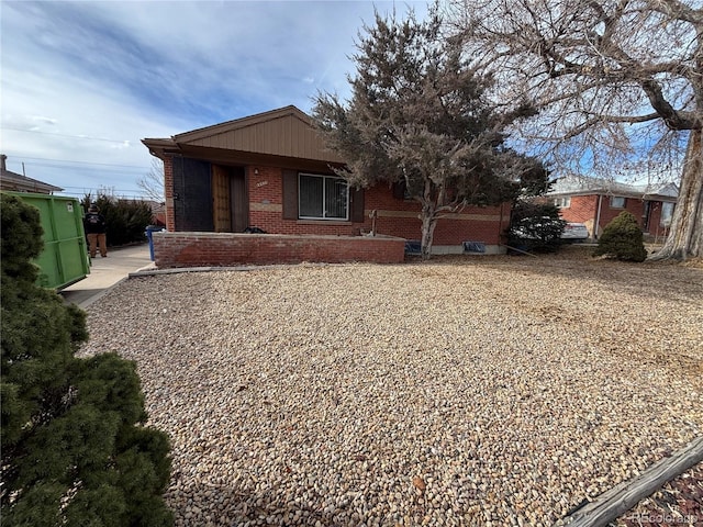view of front of house featuring brick siding