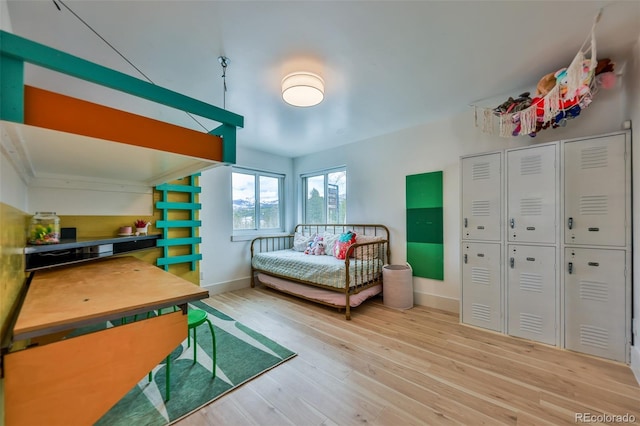 bedroom with hardwood / wood-style flooring