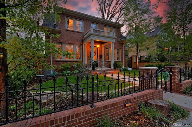 535 N High St, Denver, CO 80218 - view of front facade featuring brick siding and a gate