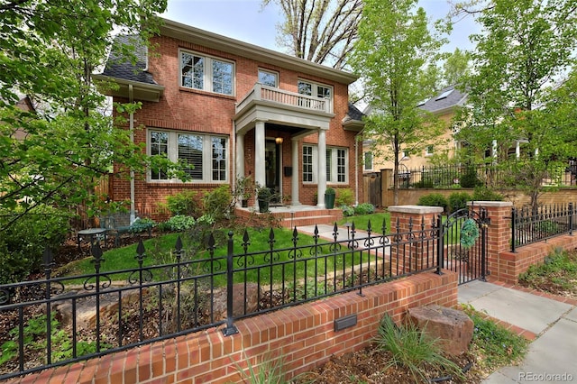 535 N High St, Denver, CO 80218 - view of front of house with brick siding, a fenced front yard, and a gate
