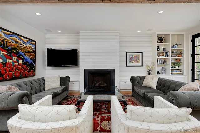 535 N High St, Denver, CO 80218 - living area featuring recessed lighting, wood finished floors, and a fireplace
