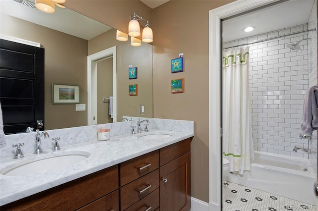 535 N High St, Denver, CO 80218 - bathroom featuring double vanity, shower / tub combo with curtain, toilet, and tile patterned floors