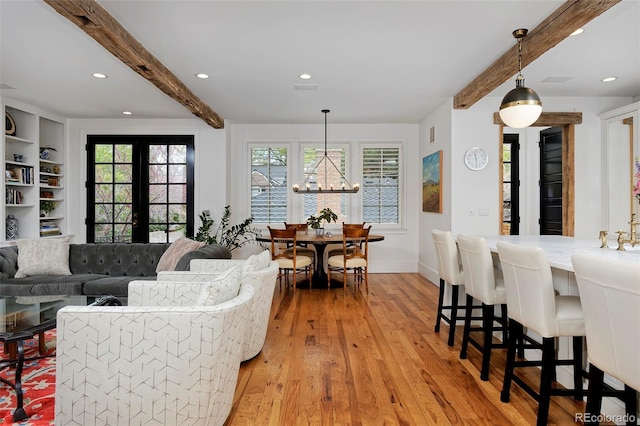535 N High St, Denver, CO 80218 - living room with beamed ceiling, light wood-type flooring, recessed lighting, a chandelier, and baseboards