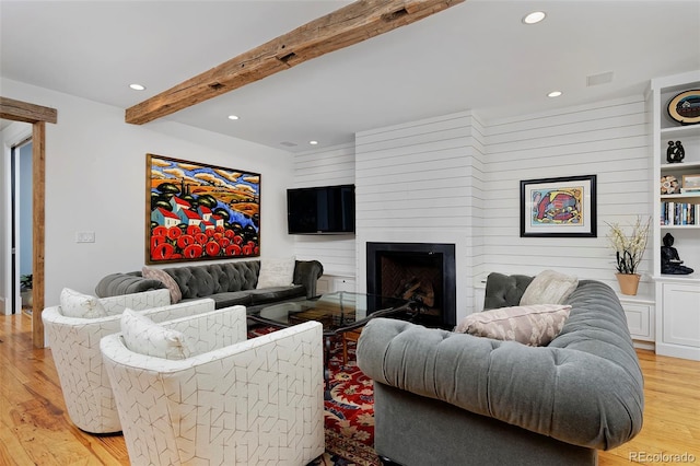 535 N High St, Denver, CO 80218 - living area with light wood finished floors, recessed lighting, a large fireplace, and beamed ceiling