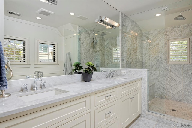 535 N High St, Denver, CO 80218 - full bathroom featuring a marble finish shower, double vanity, and recessed lighting