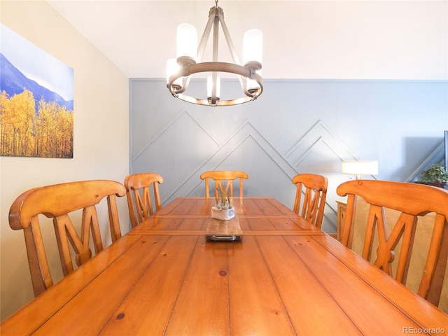 dining space featuring a notable chandelier