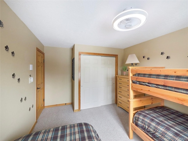 carpeted bedroom featuring a closet