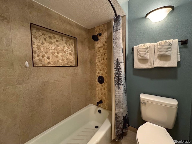 bathroom with shower / tub combo, a textured ceiling, and toilet