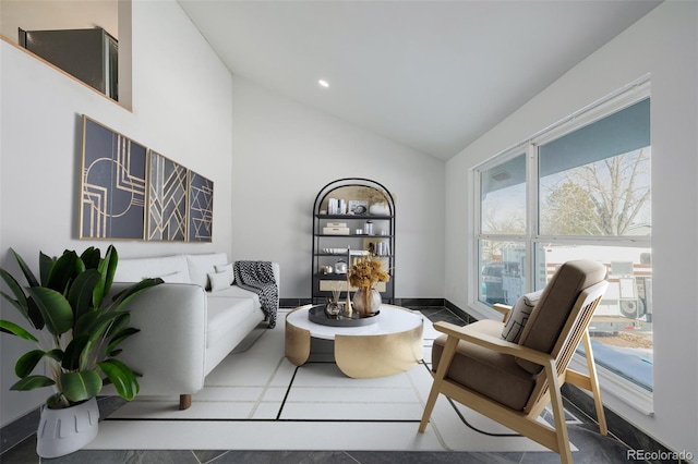 sitting room with high vaulted ceiling