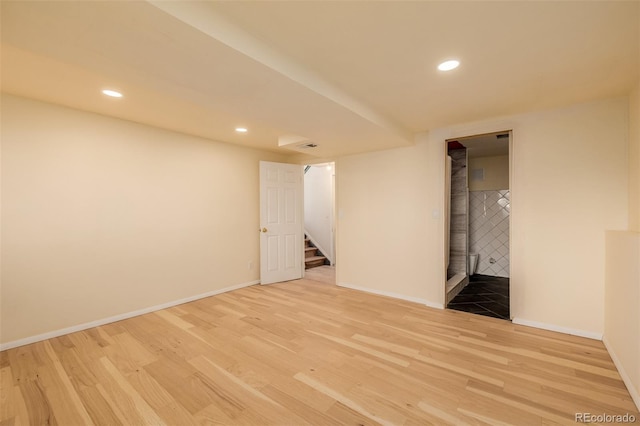 unfurnished room with light hardwood / wood-style floors