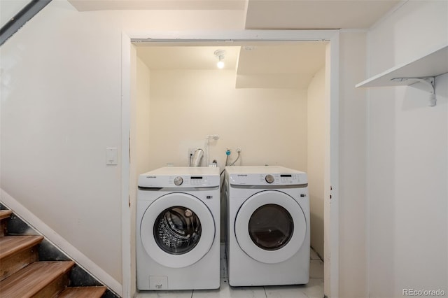 clothes washing area with washing machine and clothes dryer