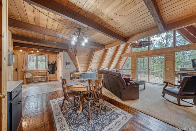 16495 Mt Princeton Rd, Buena Vista, CO 81211 - dining area with wood walls, hardwood / wood-style floors, wood ceiling, and a chandelier