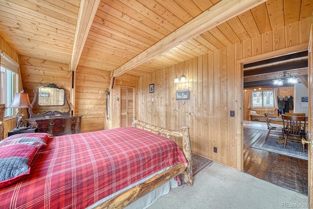 16495 Mt Princeton Rd, Buena Vista, CO 81211 - carpeted bedroom featuring wooden walls and wooden ceiling with exposed beams