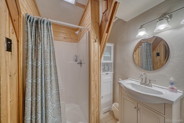 16495 Mt Princeton Rd, Buena Vista, CO 81211 - bathroom with vanity, a textured wall, tile patterned floors, and shower / tub combo