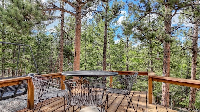 16495 Mt Princeton Rd, Buena Vista, CO 81211 - deck featuring a wooded view and outdoor dining area