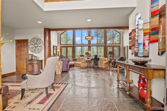 living room with a towering ceiling