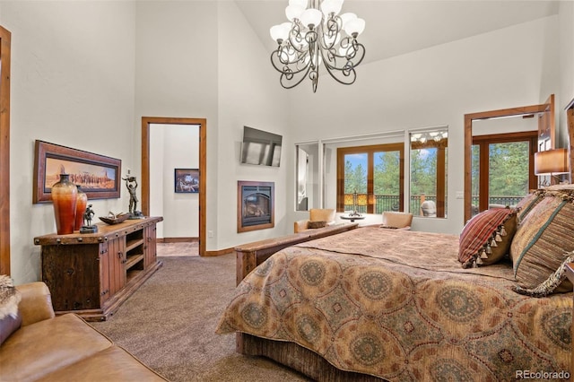 bedroom with carpet floors, high vaulted ceiling, and a chandelier