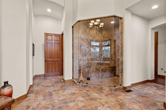 entrance foyer with a towering ceiling and a notable chandelier