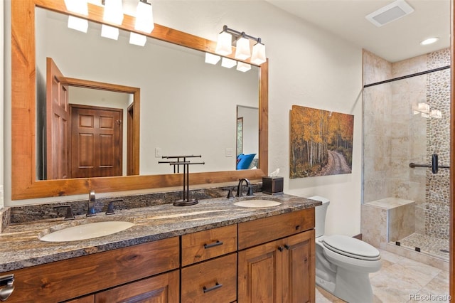 bathroom featuring vanity, an enclosed shower, and toilet