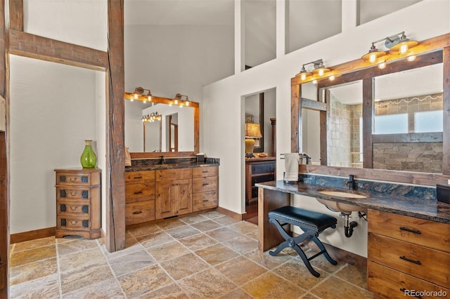 bathroom with sink and a high ceiling