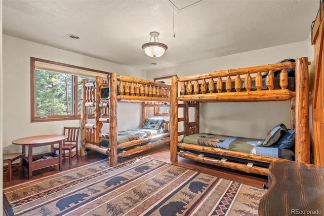 bedroom with hardwood / wood-style floors