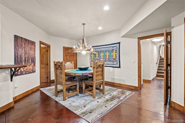 dining area featuring a chandelier