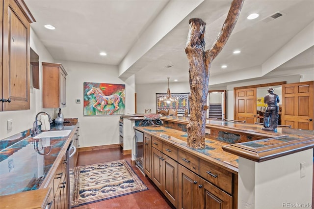 kitchen with pendant lighting, a spacious island, sink, wine cooler, and stainless steel dishwasher