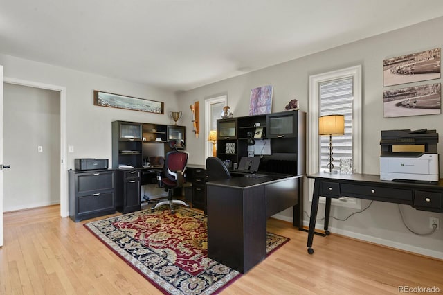 office space featuring light wood finished floors and baseboards